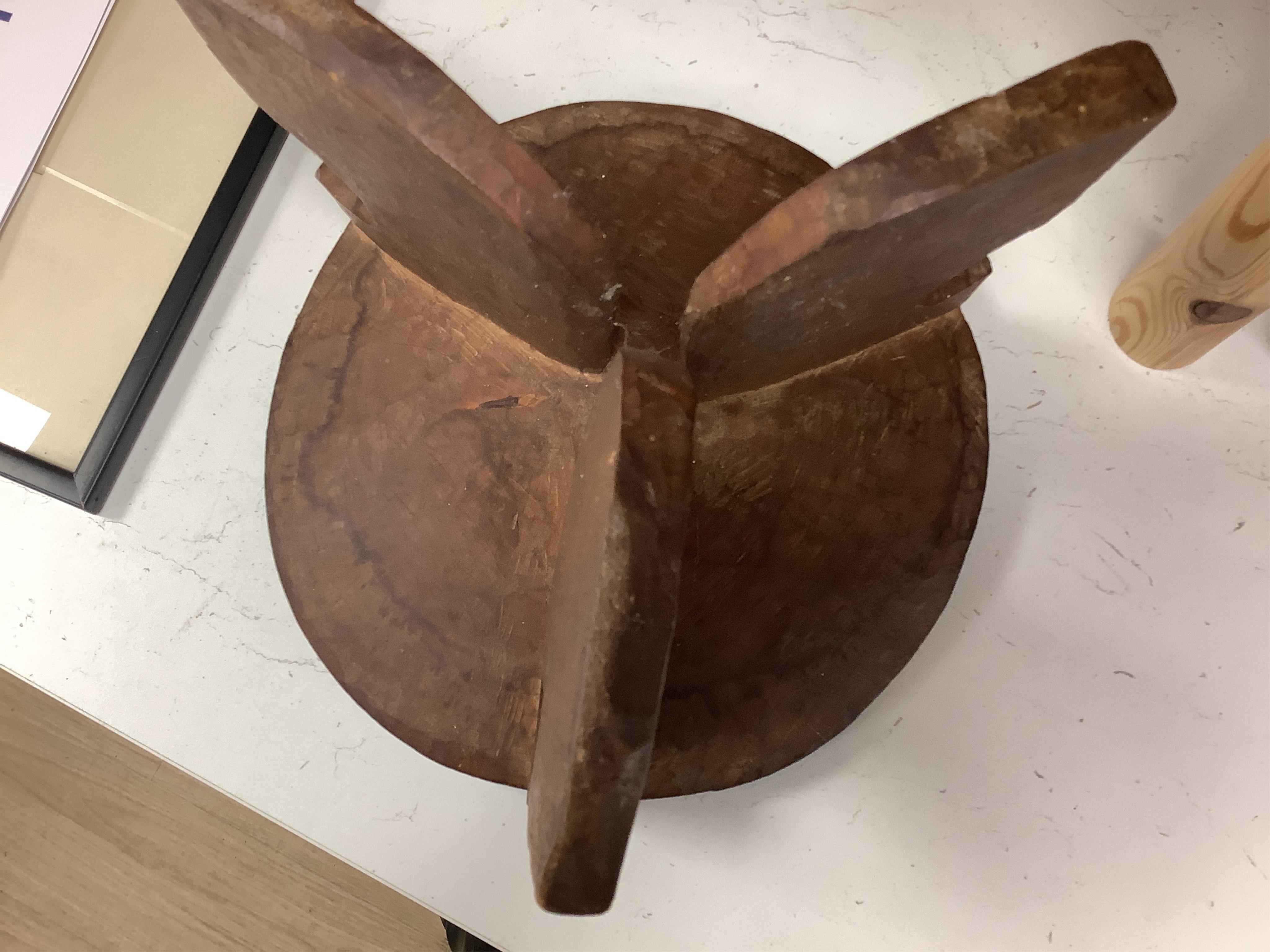 Two African tribal busts, two carved spoons and three carved Kamba Kenyan stools (11). Largest stool 28cm high. Condition - mostly good, some staining to seat of largest stool